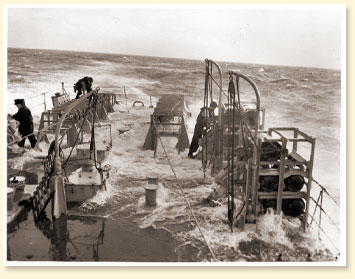 Quarterdeck of R.C.N. frigate in rough seas off Halifax, N.S., January 1944 - Photo Credit: National Defence - RCN L-4521, CWM Reference Photo Collection - AN19910238-795
