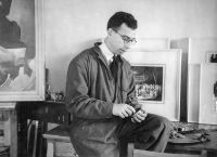 War artist Harold Freedman pictured in his studio preparing for an exhibition of his war paintings ; taken in Melbourne Victoria, c.1946; donated by the artist to the collection of the Australian War Memorial; P00925.001