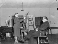 War artist Captain Stella Bowen at work on a portrait of Group Captain D. T. Forsyth DFC; taken in Yorkshire, England, 1944; from the collection of the Australian War Memorial UK2342