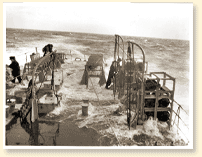 Quarterdeck of R.C.N. frigate in rough seas off Halifax, N.S., January 1944 - Photo Credit: National Defence - RCN L-4521, CWM Reference Photo Collection - AN19910238-795