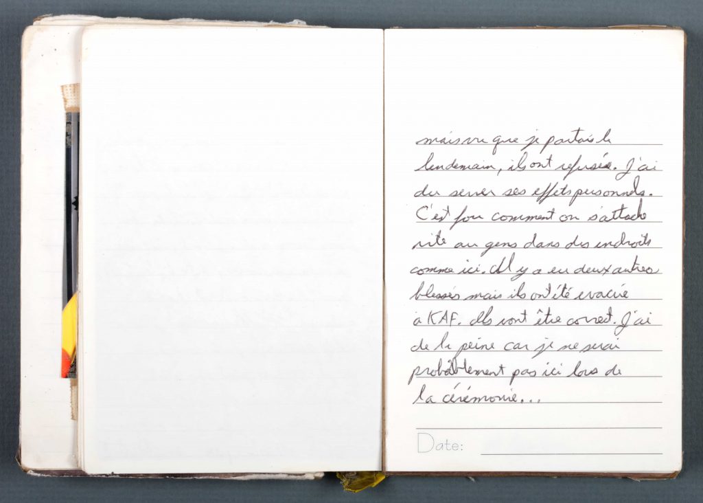 A well-worn diary with handwritten entries