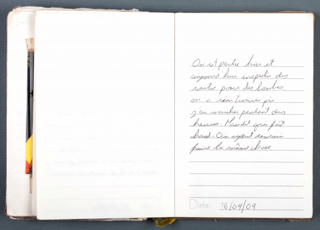 A well-worn diary with handwritten entries