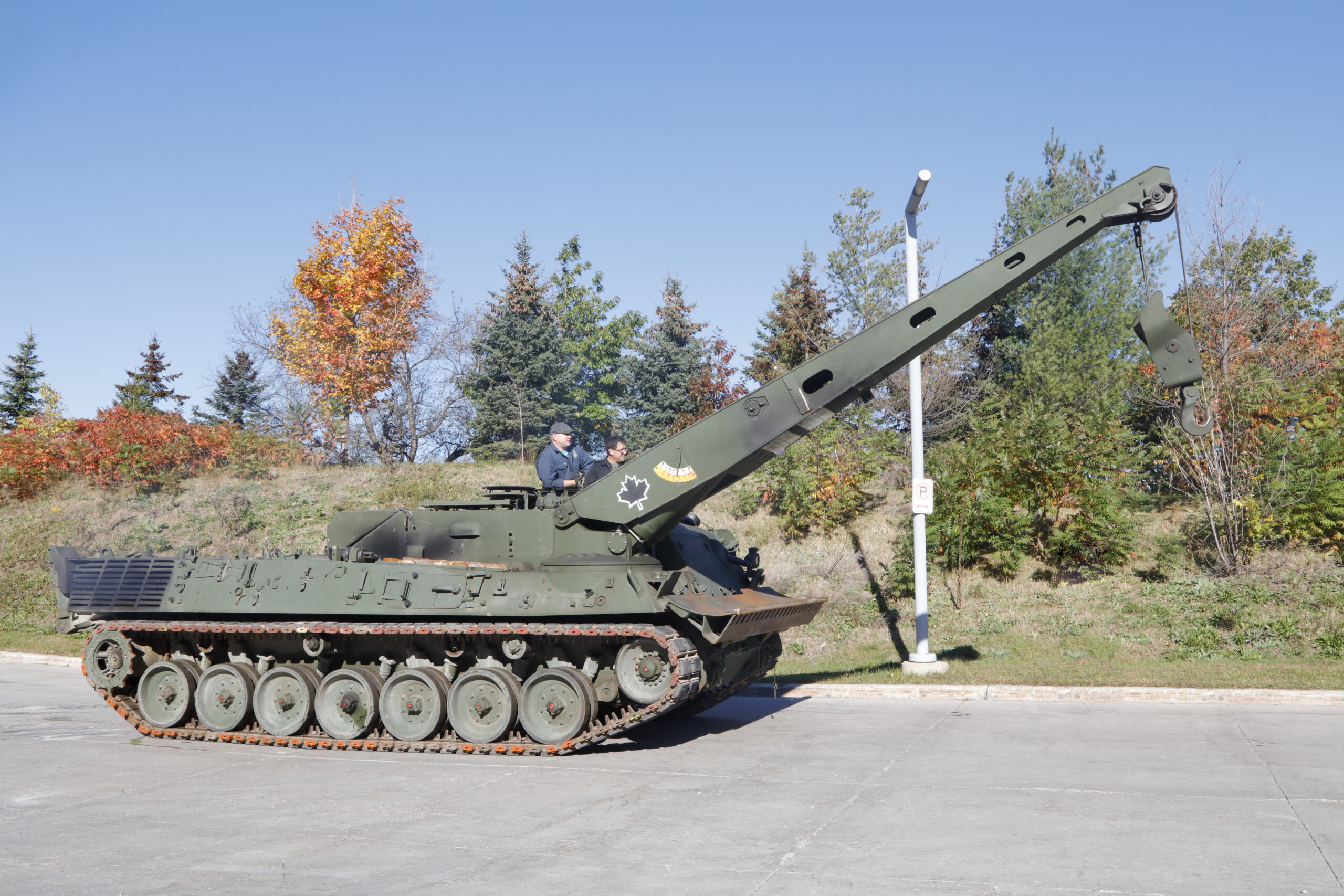 A long, tracked armoured vehicle with a large folded-down metal structure on top.